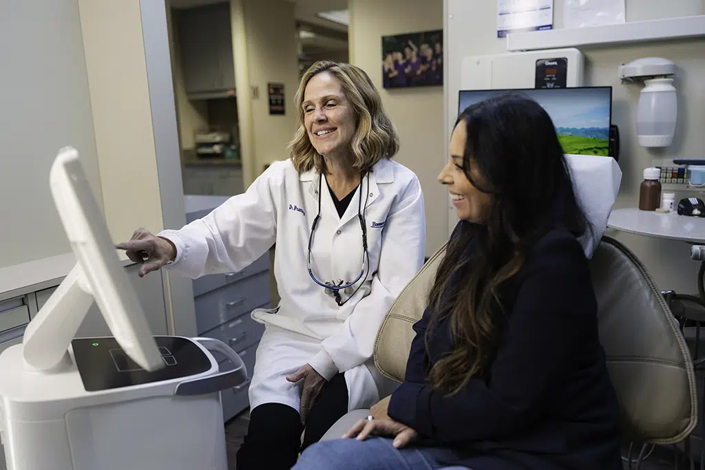 Dentist with patient explaining treatment options