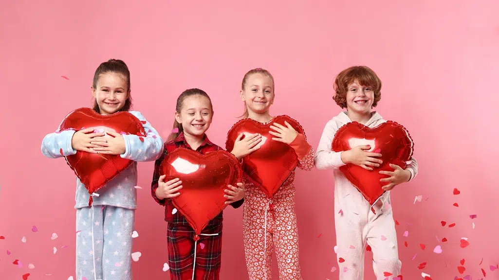 Kids with Valentine's Day balloons