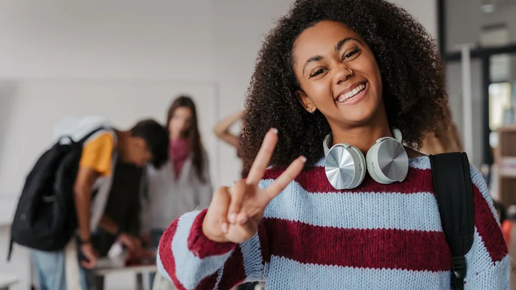 Teen student smiling at school during back-to-school season